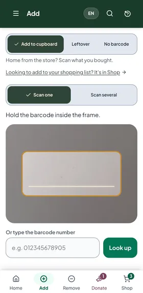 The app's Add screen ready to scan: Add to cupboard and Scan one are picked, with a frame to hold the barcode in and a box to type the barcode number instead.